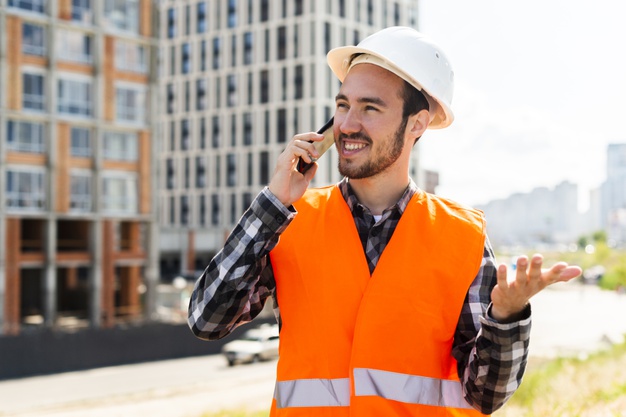 medium-shot-portrait-construction-engineer-talking-phone_23-2148233685